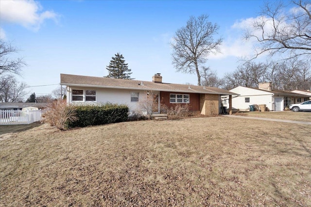 ranch-style home with a front yard