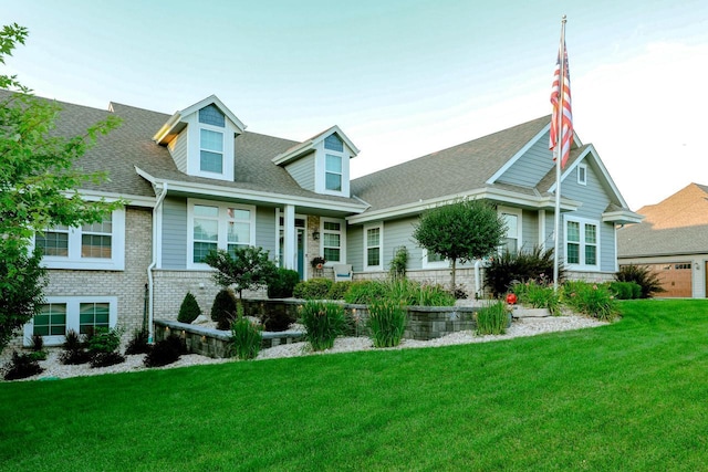 cape cod house featuring a front lawn