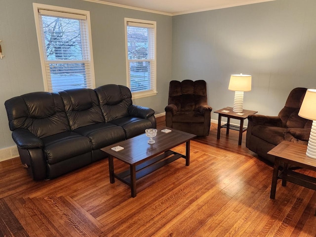 living room with crown molding and hardwood / wood-style flooring