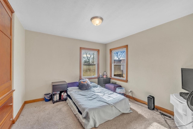 bedroom with light colored carpet