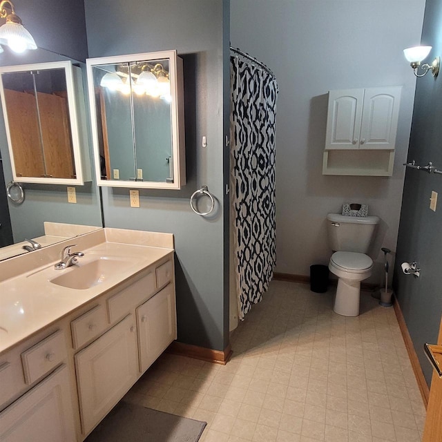 bathroom with toilet and vanity