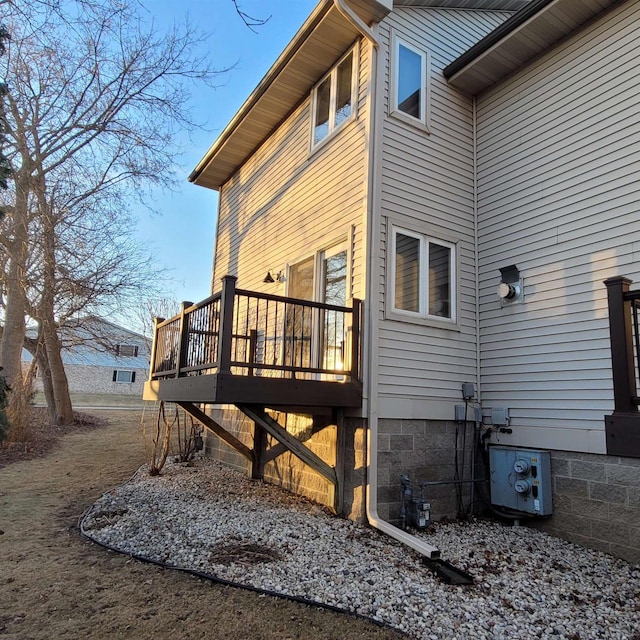 view of side of home with a deck