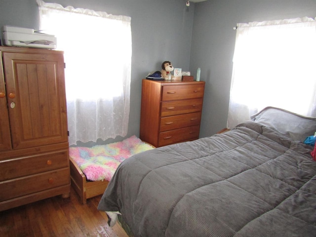 bedroom with hardwood / wood-style flooring