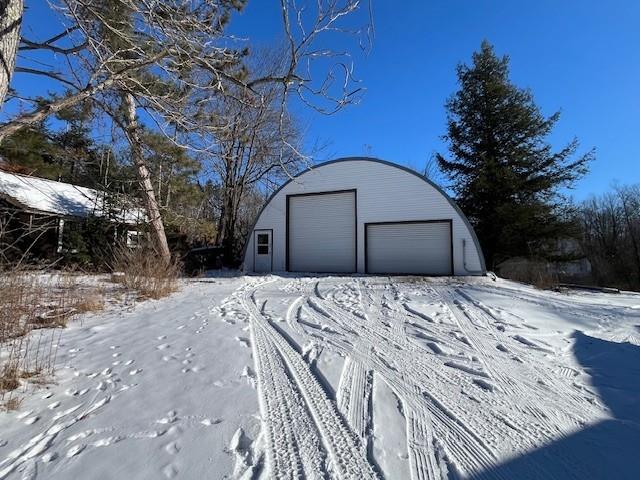 view of snow covered garage