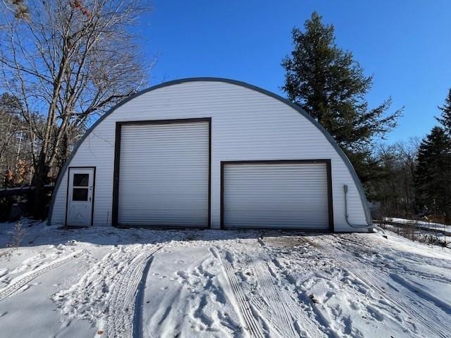 view of snow covered garage