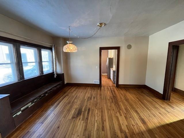 empty room featuring hardwood / wood-style floors