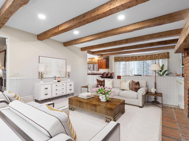 living room with beam ceiling