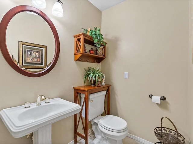 bathroom featuring toilet and sink