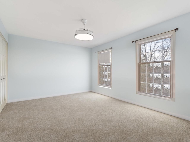 unfurnished room featuring carpet flooring