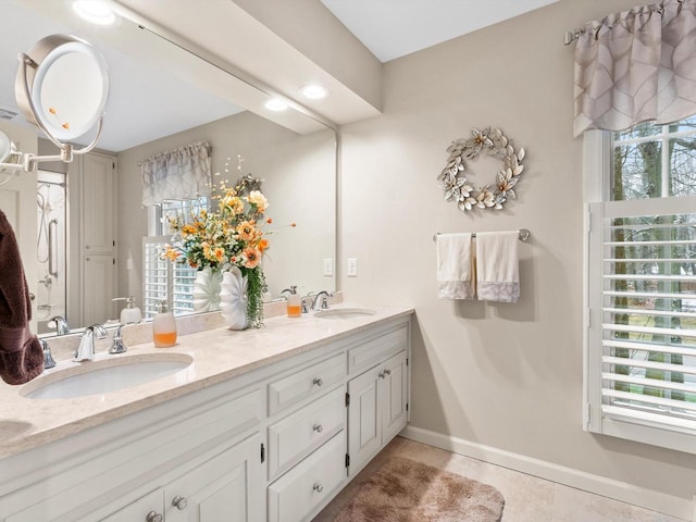 bathroom featuring tile patterned floors and vanity