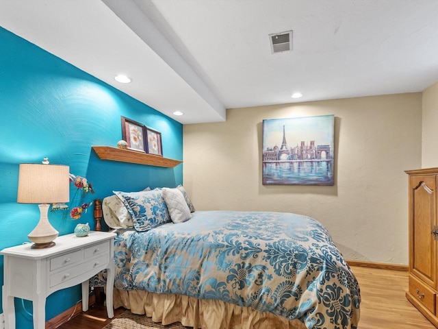 bedroom with light hardwood / wood-style floors