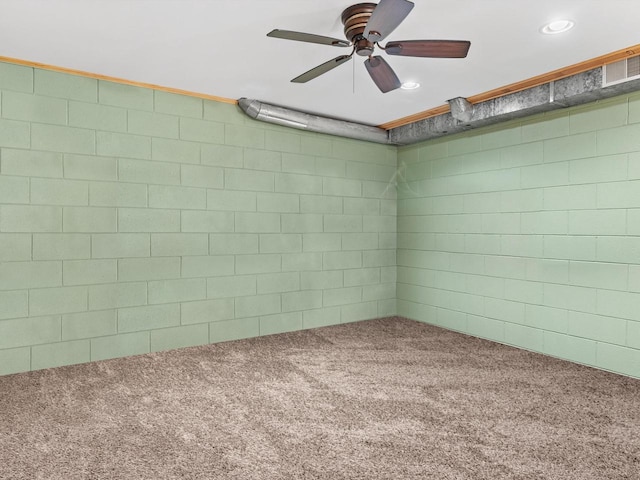 empty room featuring ceiling fan and carpet flooring