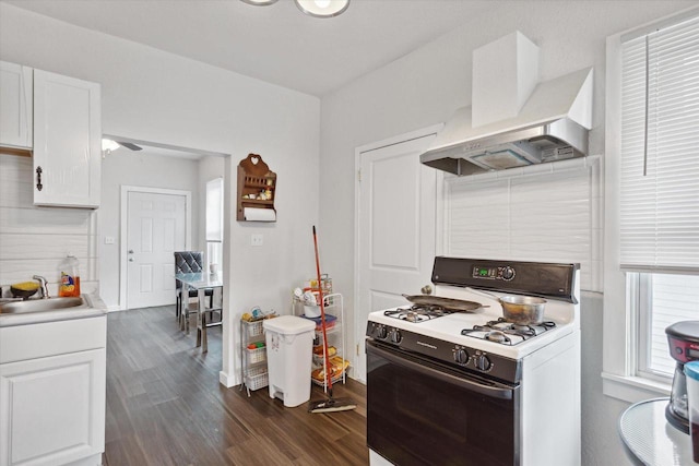 kitchen with white cabinets, custom exhaust hood, dark wood-type flooring, sink, and white range with gas stovetop