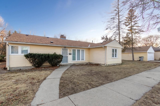 ranch-style house with a lawn