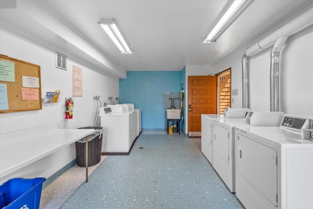 laundry area with washing machine and dryer