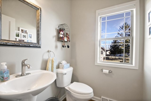 bathroom featuring toilet and sink