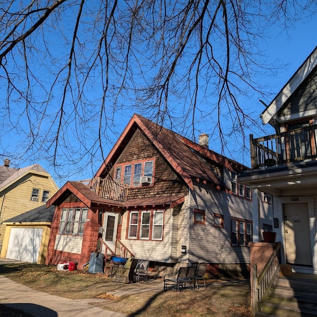 view of front of home featuring a garage and a balcony