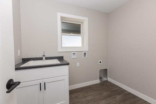 663 Carlyle Dr, Belmont, WI 53510 - laundry room featuring washer hookup, sink, dark hardwood / wood-style flooring, and electric dryer hookup