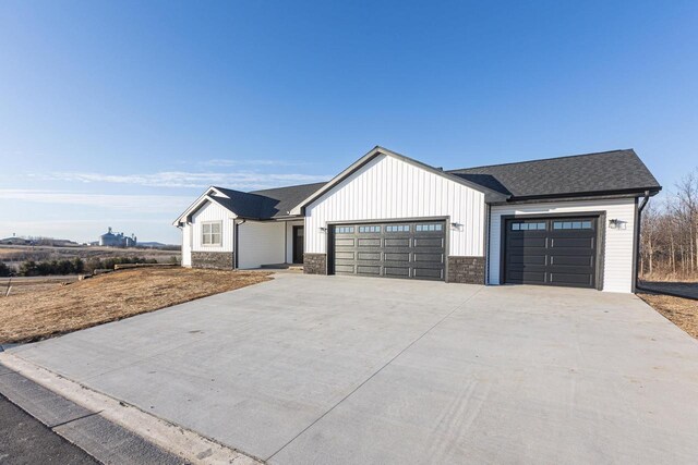 663 Carlyle Dr, Belmont, WI 53510 - modern farmhouse featuring a garage