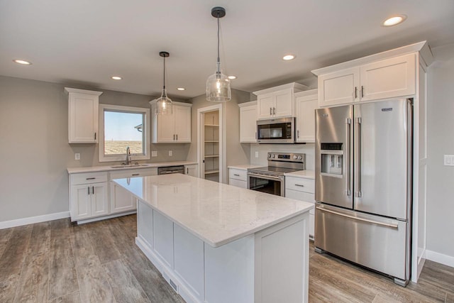 663 Carlyle Dr, Belmont, WI 53510 - kitchen featuring white cabinets, appliances with stainless steel finishes, sink, and light hardwood / wood-style floors