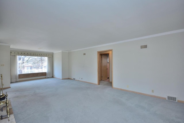 empty room with light colored carpet and ornamental molding