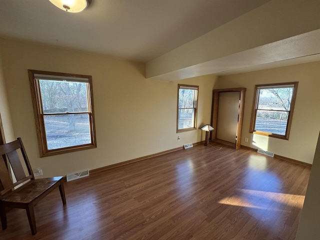 spare room with dark hardwood / wood-style floors