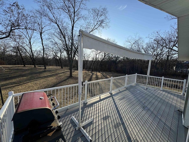 wooden terrace with a grill