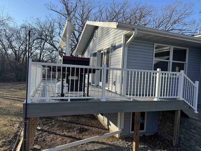 view of side of property with a wooden deck