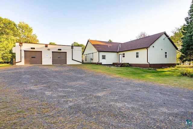 view of front facade with a front lawn and a garage