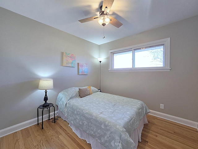 bedroom featuring ceiling fan and light hardwood / wood-style floors