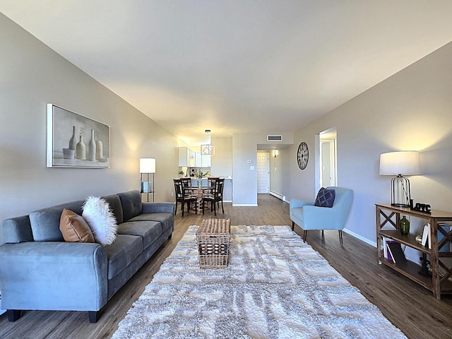 living room with dark hardwood / wood-style floors