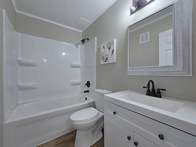 full bathroom featuring toilet, bathing tub / shower combination, hardwood / wood-style floors, crown molding, and vanity