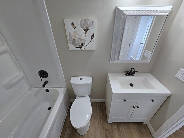 full bathroom featuring hardwood / wood-style flooring, shower / bath combination, toilet, and vanity