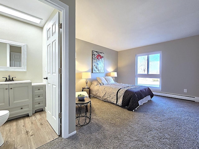 bedroom featuring a baseboard heating unit