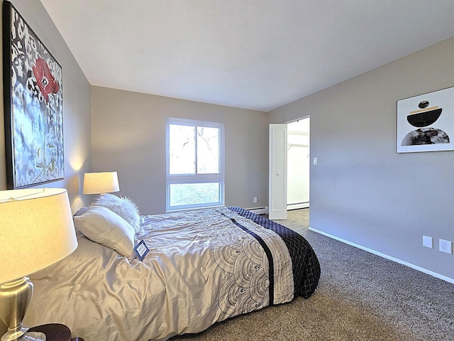 carpeted bedroom featuring baseboard heating