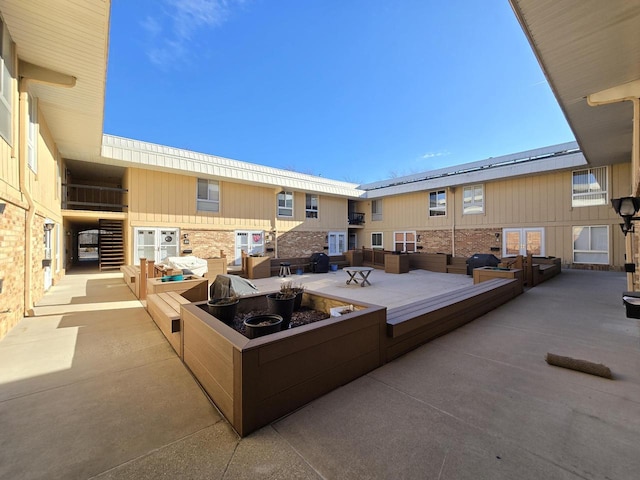 view of patio with an outdoor fire pit