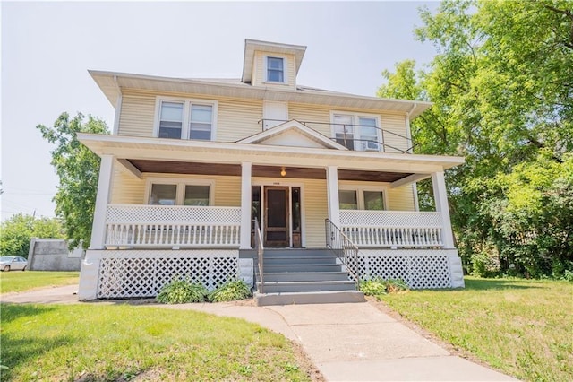 view of front of property featuring a front yard and a porch