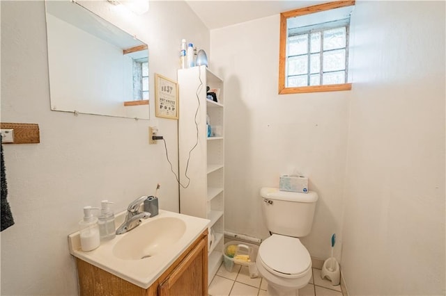 1010 S Farwell St, Eau Claire, WI 54701 - bathroom with toilet, tile patterned floors, and vanity