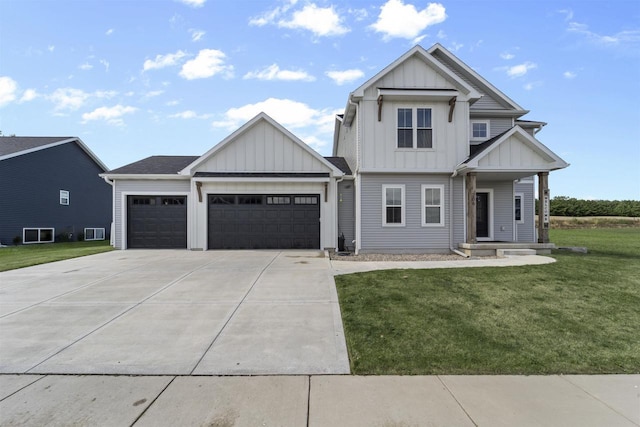 view of front of property with a front yard and a garage