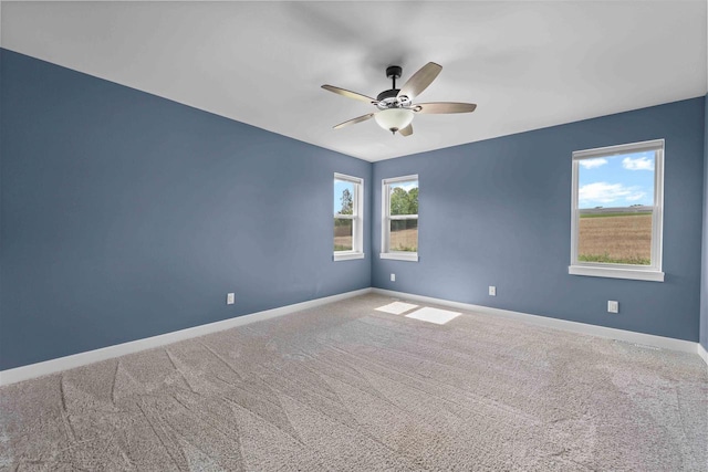 unfurnished room featuring carpet floors and ceiling fan