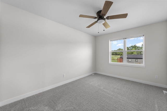 empty room with ceiling fan and carpet flooring