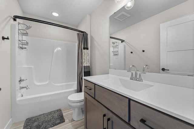 full bathroom with hardwood / wood-style flooring, toilet, vanity, and shower / bathtub combination with curtain