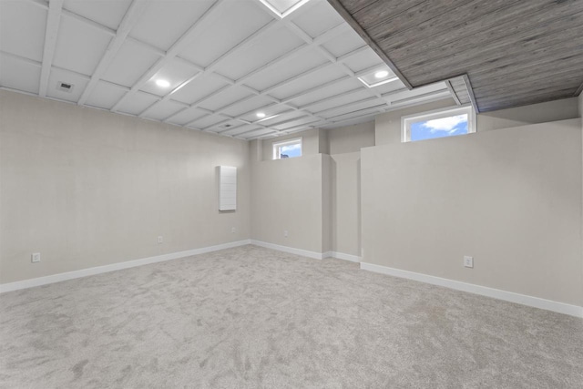 basement with carpet floors and a healthy amount of sunlight