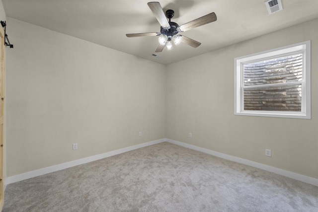 carpeted empty room with ceiling fan