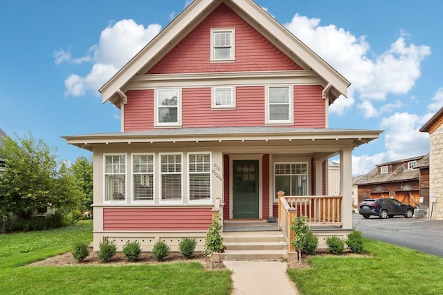 view of front of property with a front lawn and a porch