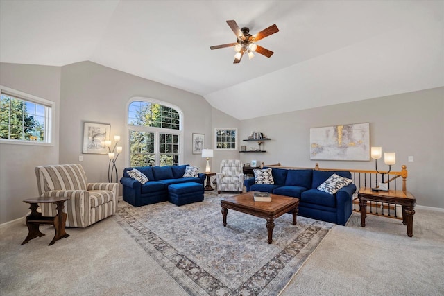 living room featuring lofted ceiling, light colored carpet, and ceiling fan