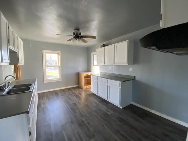 kitchen with ceiling fan, sink, white cabinets, and dark hardwood / wood-style floors