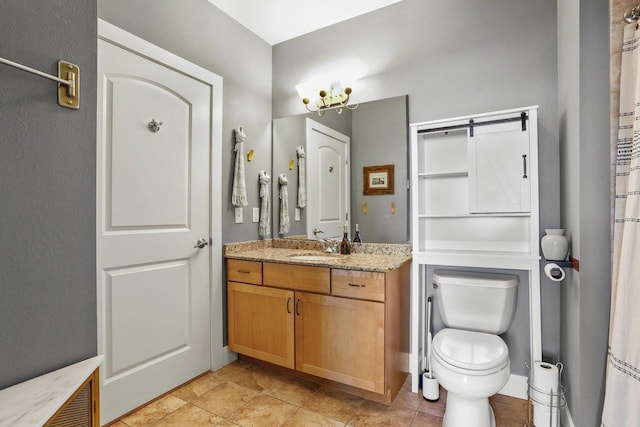 bathroom with toilet and vanity