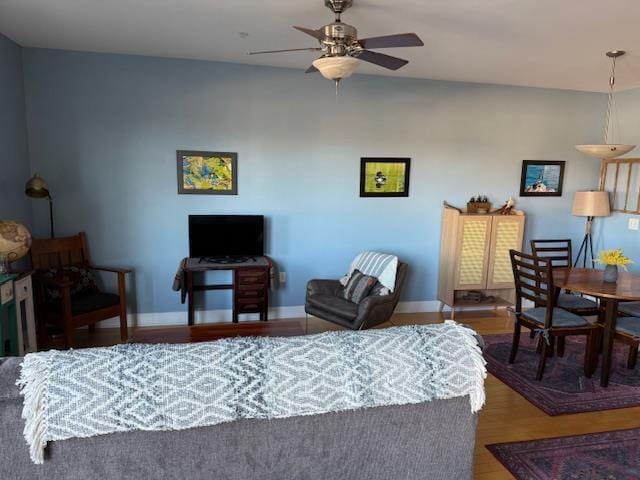 bedroom featuring ceiling fan and dark hardwood / wood-style flooring