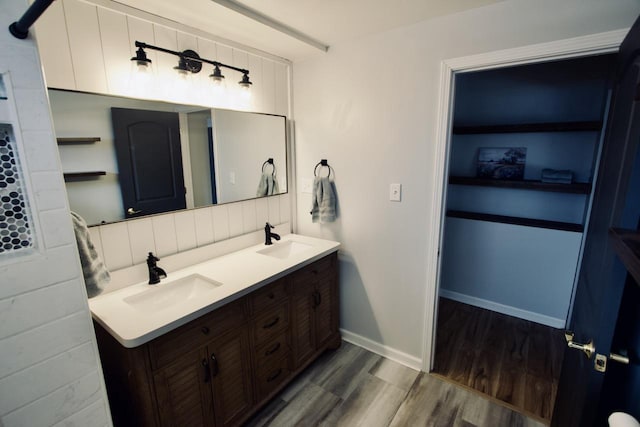 bathroom with vanity and hardwood / wood-style flooring